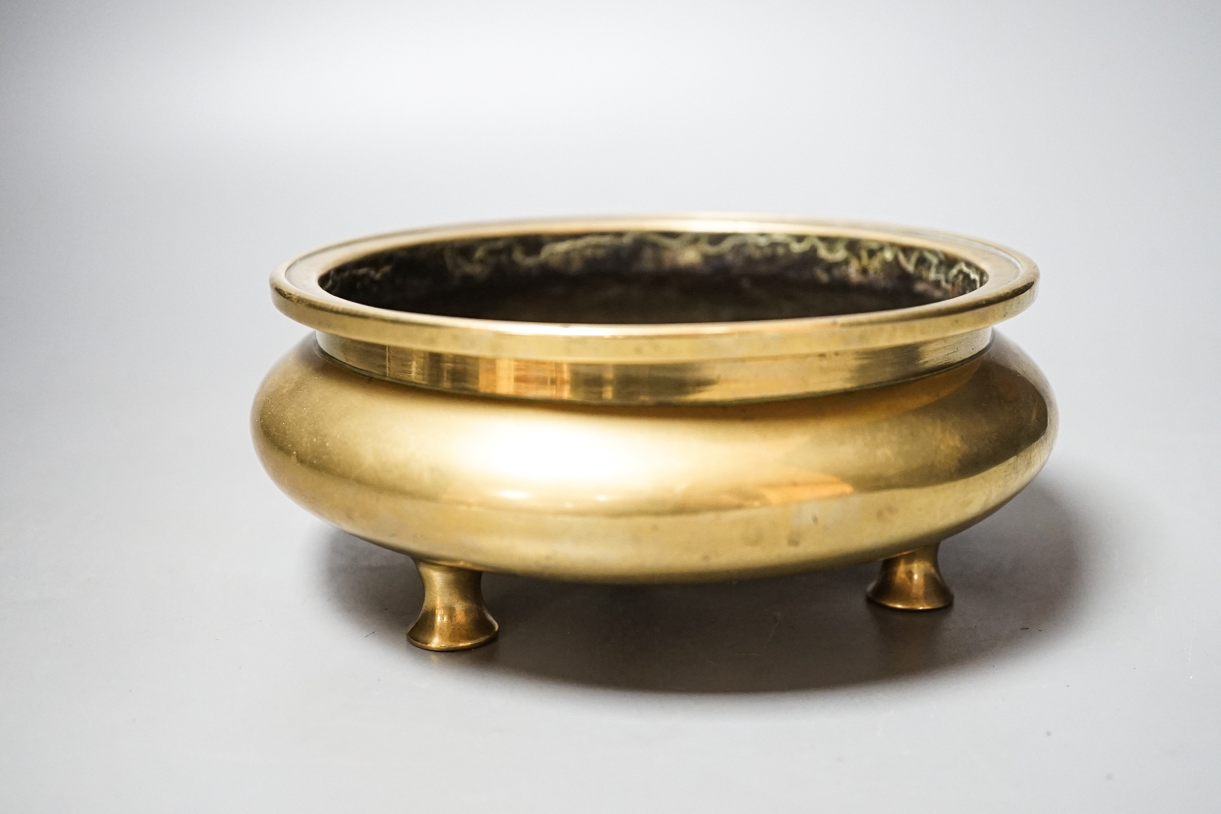 A Chinese bronze censer, ding, Xuande mark, 18th / 19th century, diameter 16.6cm, height 6.7cm